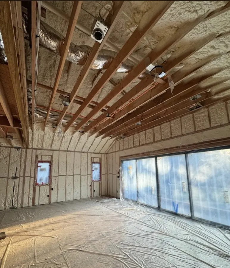 Interior walls and ceiling insulated with spray foam during new construction in Tigard